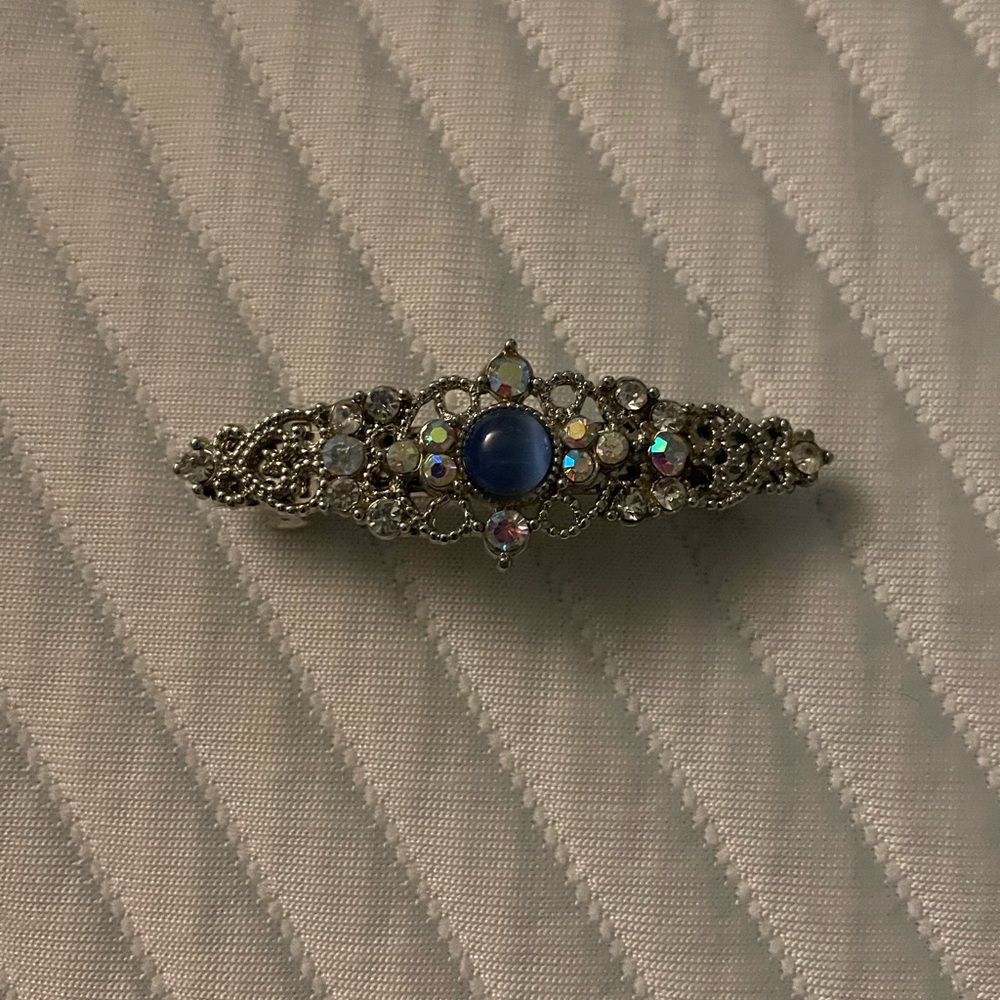 Elegant Silver tone and rhinestone hair clip with blue gemstone